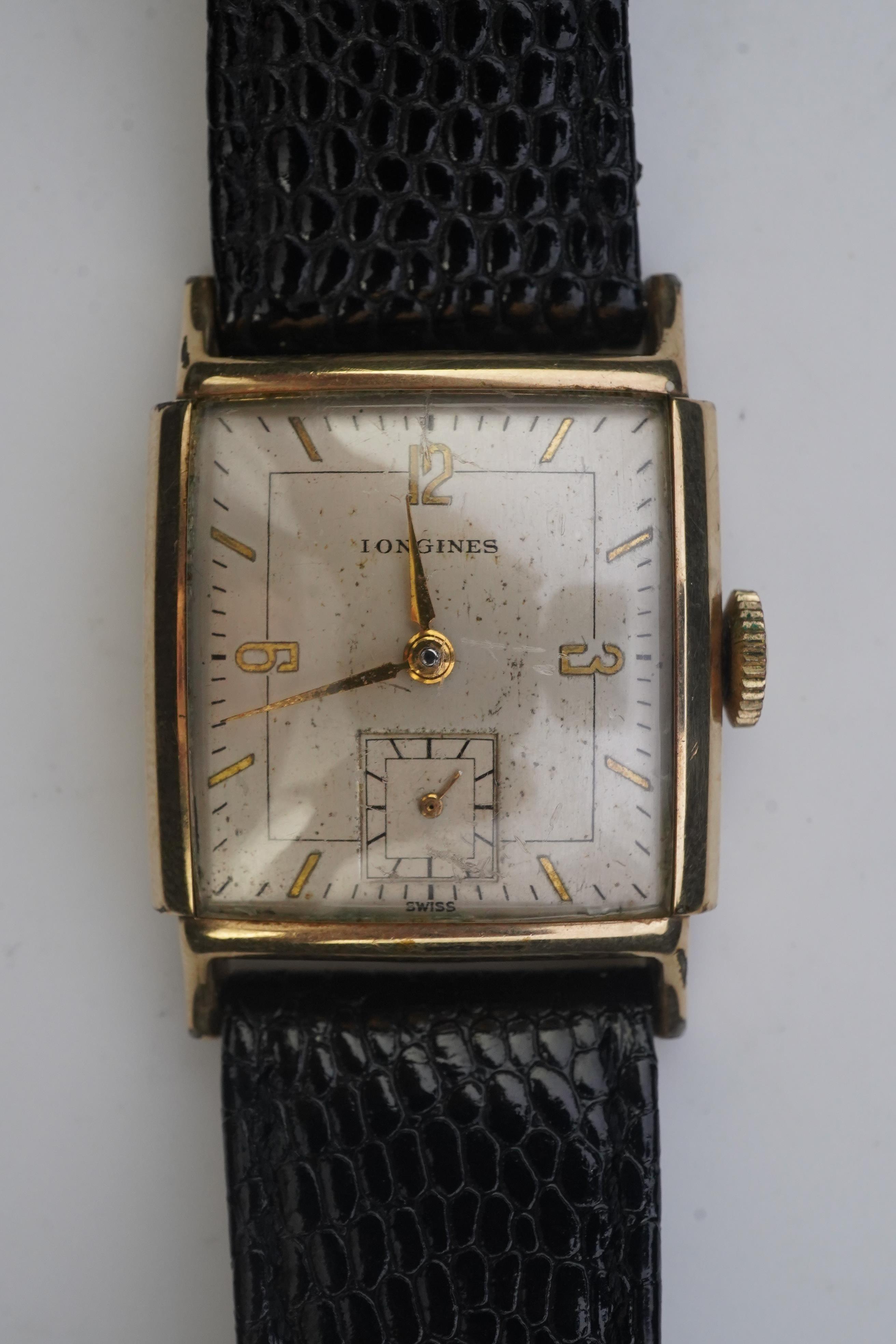 A gentleman's late 1940's gold plated Longines manual wind wrist watch, on a later associated leather strap